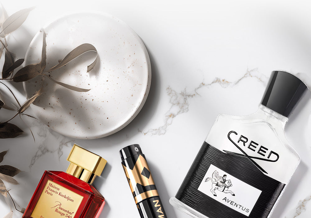 Background image featuring luxury fragrance bottles.
