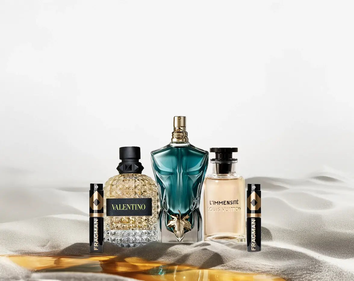 Background image featuring luxury fragrance bottles.