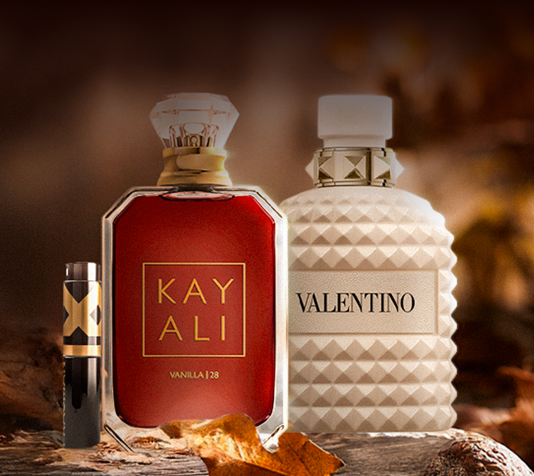 Background image featuring luxury fragrance bottles.
